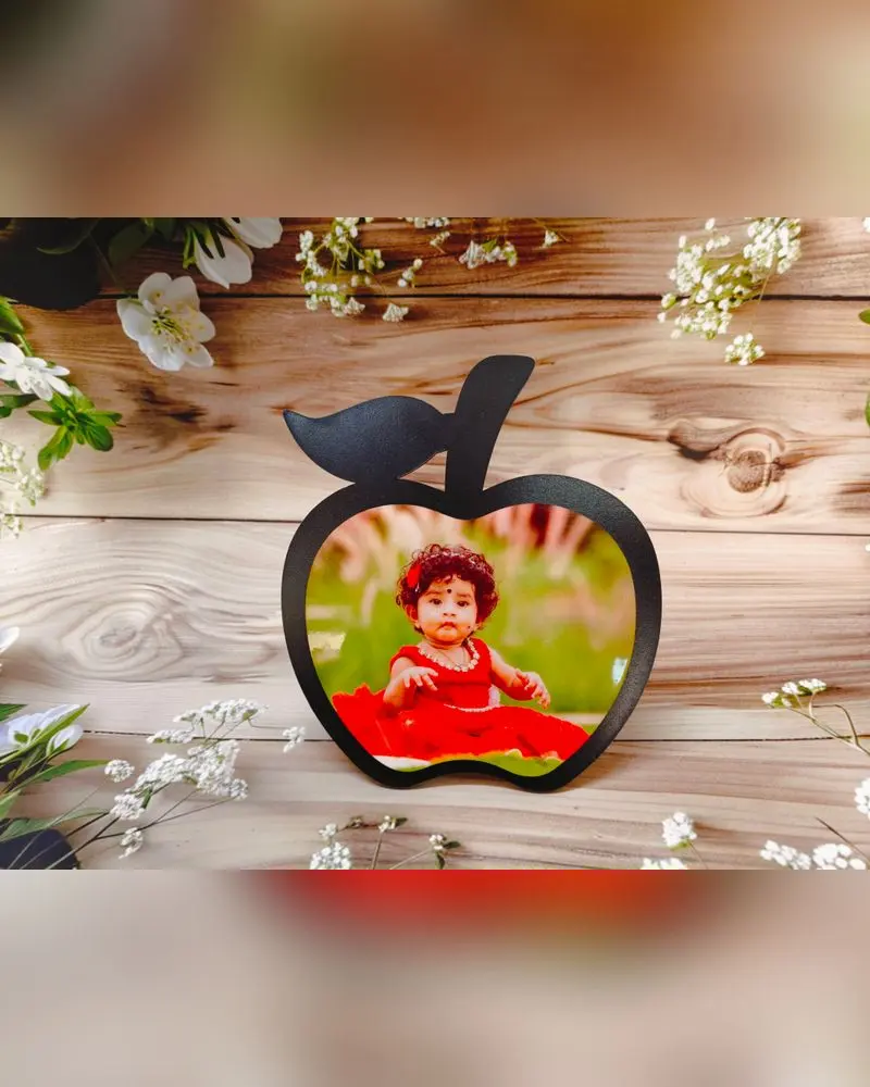 Apple-shaped MDF table frame with a baby photo