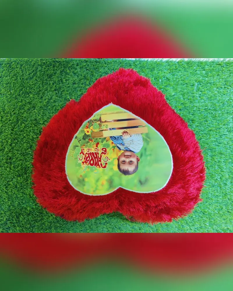 Red heart-shaped photo pillow